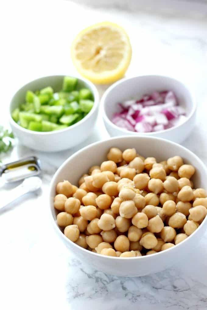 chickpea salad ingredients in bowls