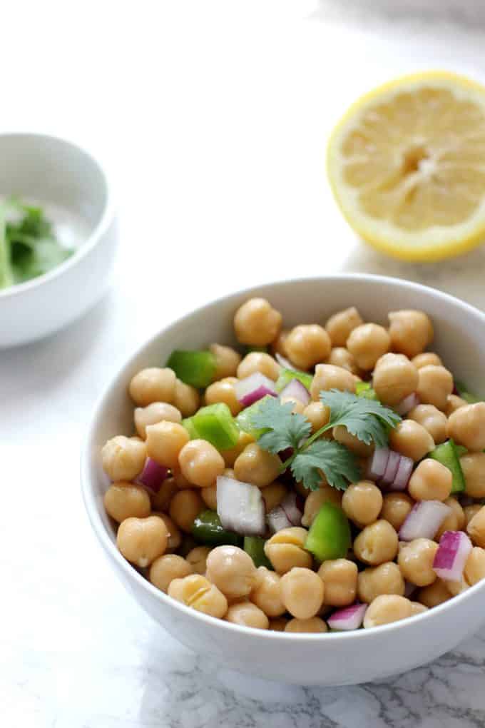 simple chickpea salad in a white bowl