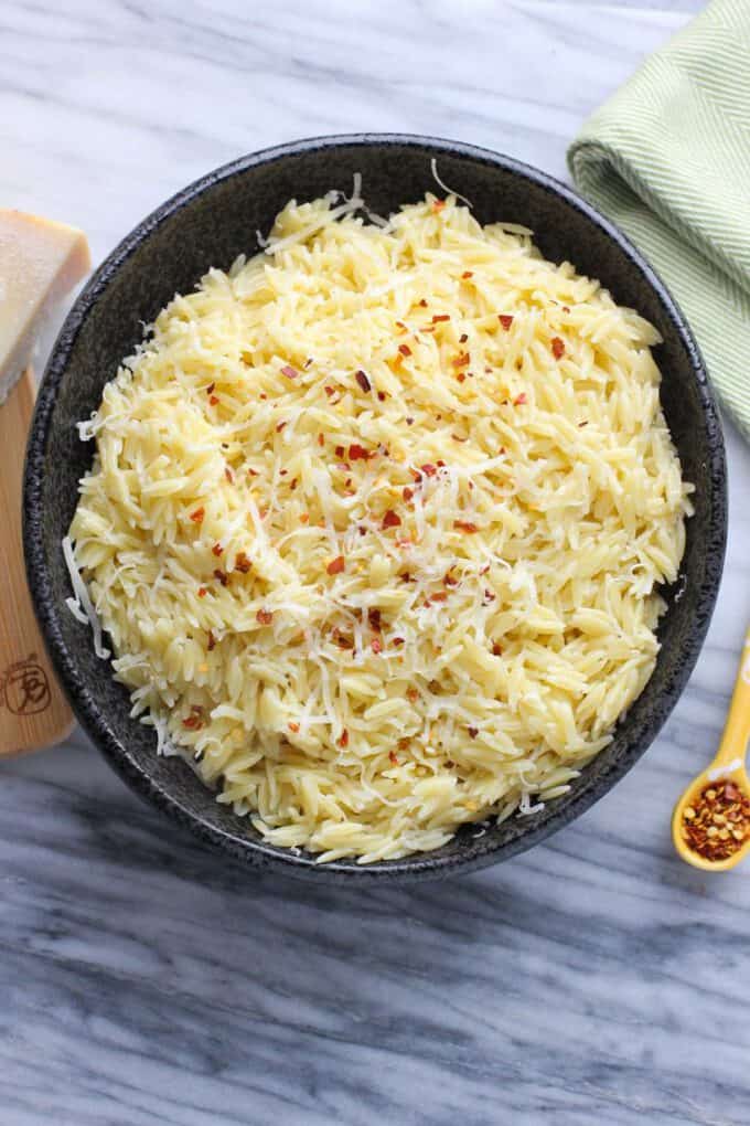 A bowl of Parmesan Orzo on a plate