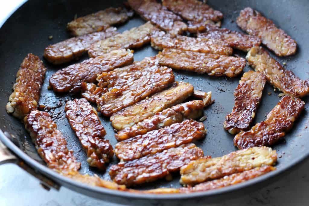 tempeh bacon in a pan