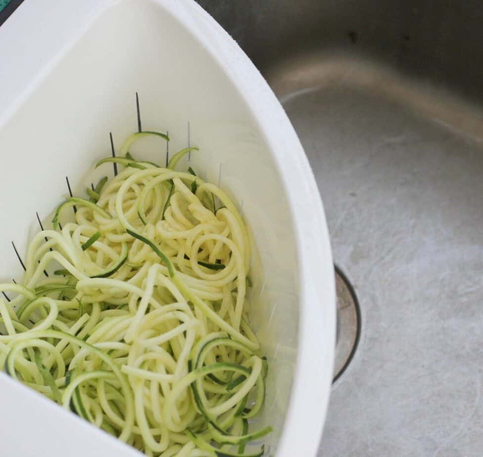 draining zucchini noodles helps remove excess moisture