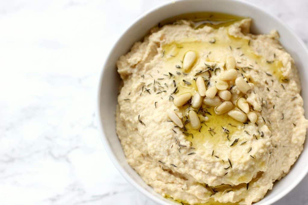 featured hummus and pine nuts