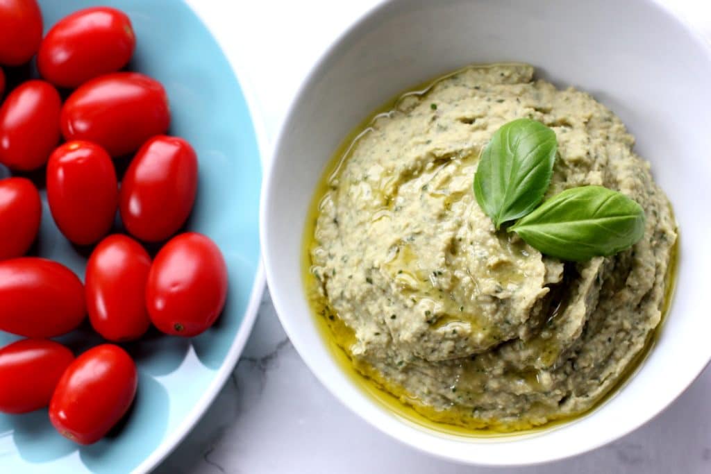 This basil pesto hummus recipe is a Zoe's Kitchen Copycat! It''s perfect with raw veggies & pita or on top of a salad!