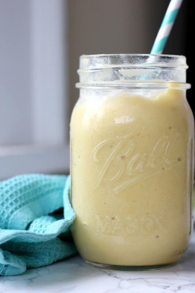 This coconut mango smoothie is like a tropical paradise in a glass! Blend it up and you've got a healthy breakfast on the go! 