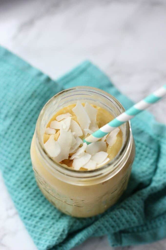 This coconut mango smoothie is like a tropical paradise in a glass! Blend it up and you've got a healthy breakfast on the go! 