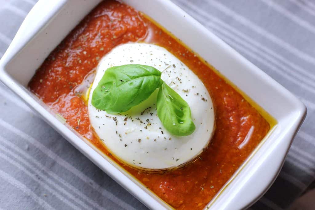 This easy baked burrata recipe is only 4 ingredients! It's the perfect quick and easy appetizer. 