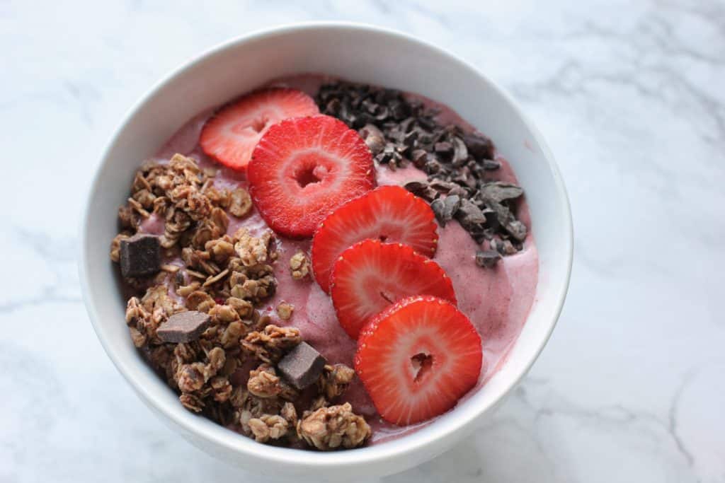 This chocolate strawberry smoothie bowl is like having dessert for breakfast! It's sweet, chocolatey, and healthy!