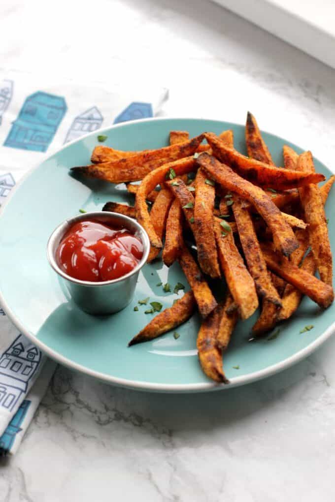 sweet potato fries on a blue plate