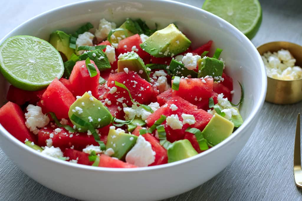 watermelon and avocado in a white bowl