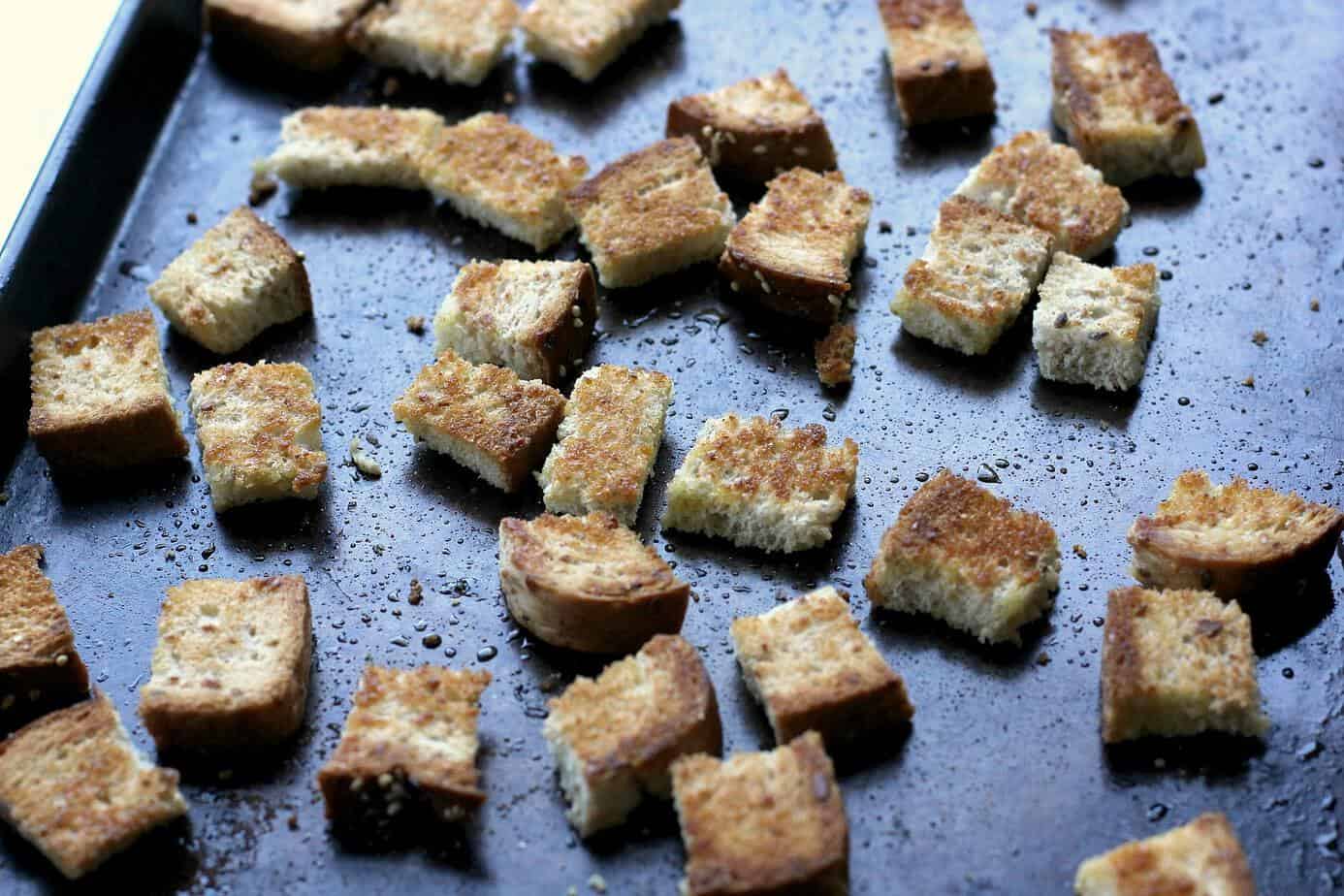 whole wheat croutons on a pan