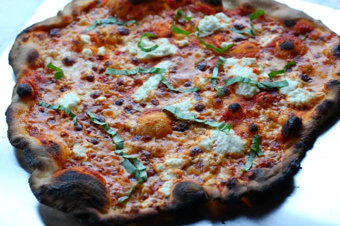 A pizza sitting on top of a table