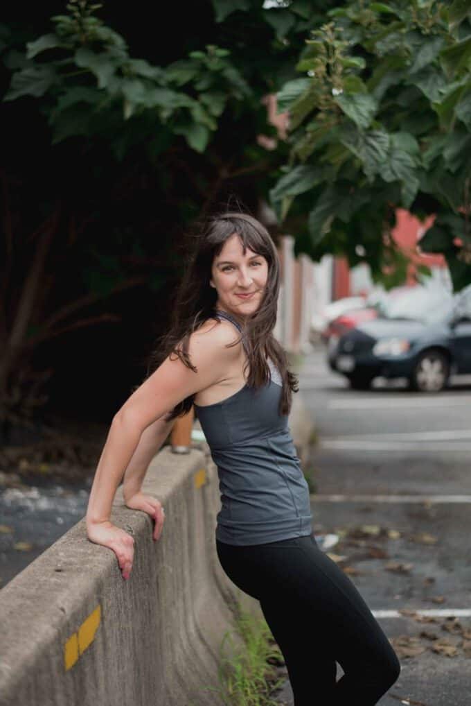 A woman standing on a sidewalk