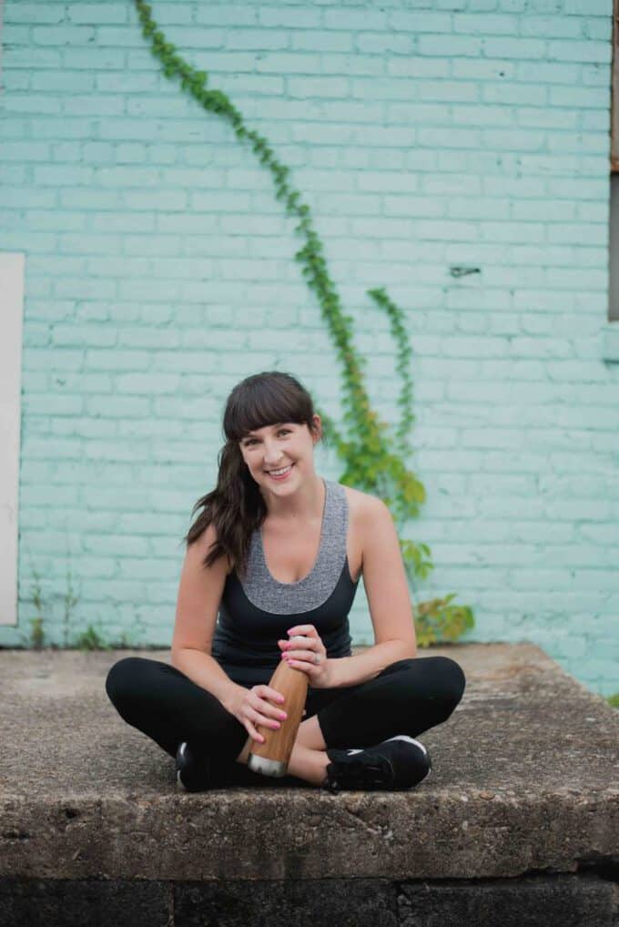 Liz sitting with a water bottle