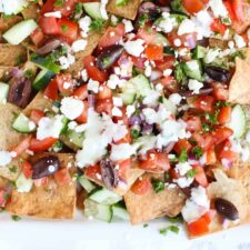 Greek nachos with many different toppings