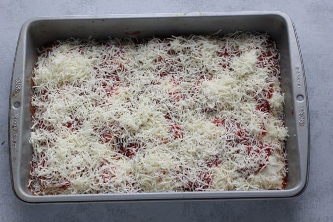 ravioli in a pan with cheese