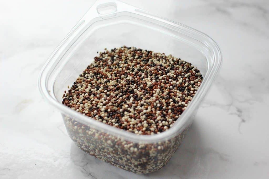 dried quinoa in a clear plastic container