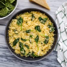 a bowl of couscous with spinach
