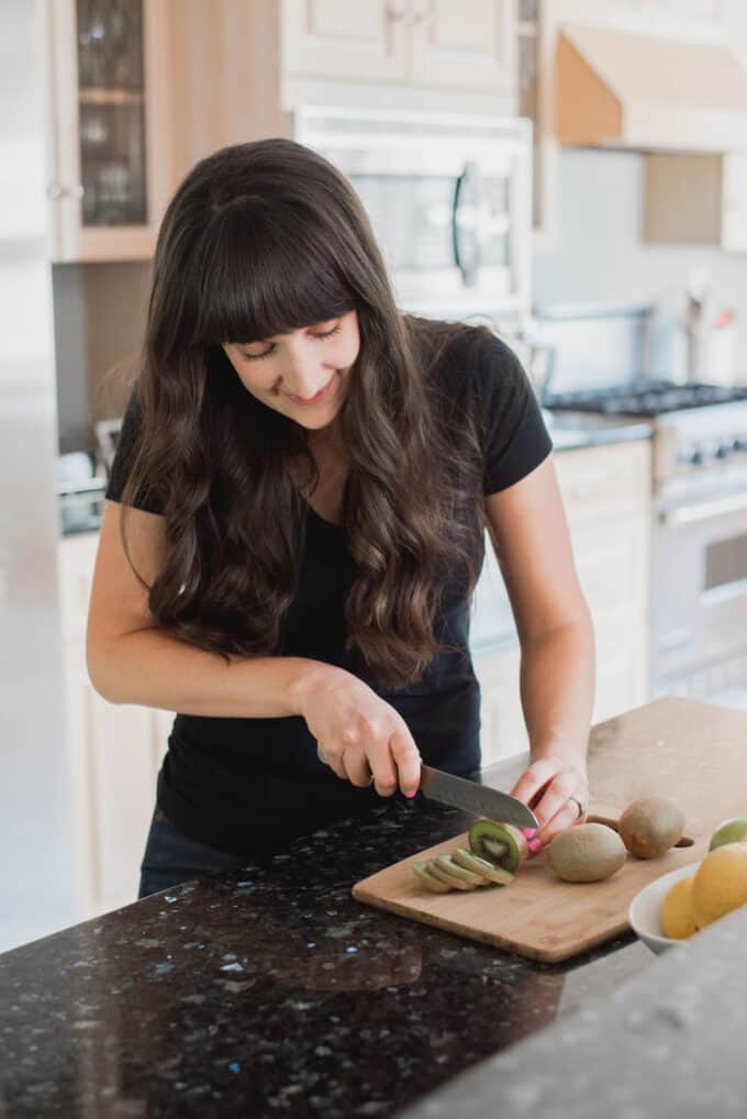 cutting kiwis in the kitchen