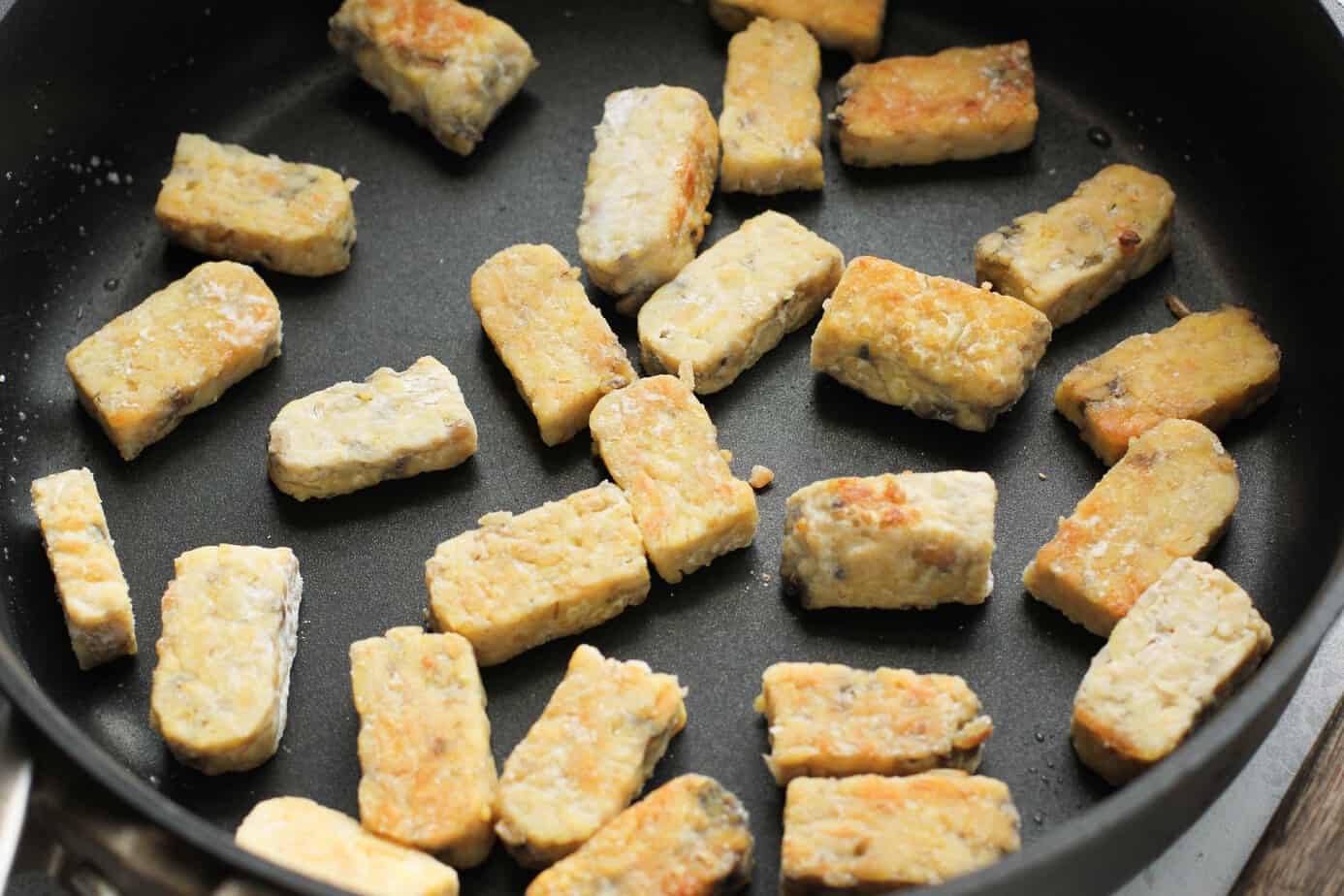 tempeh cooking in a pan