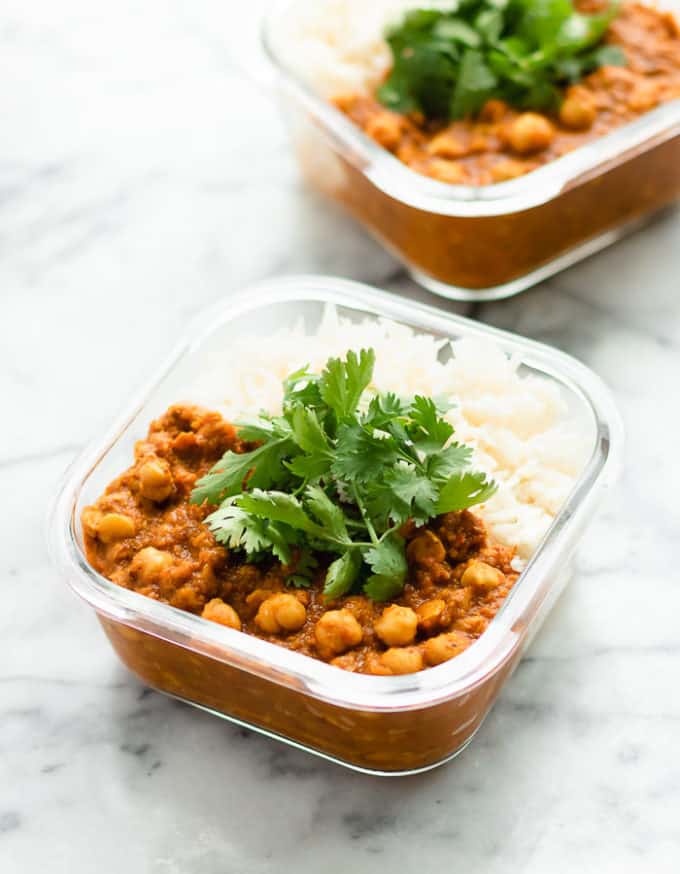 A bowl of food on a table, with Chickpea and Bean
