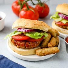 A burger sitting on top of a plate