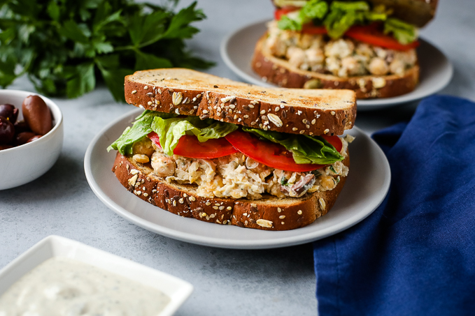 A plate of food on a table, with a  Sandwich