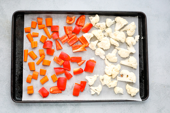 chopped vegetables on a baking sheet