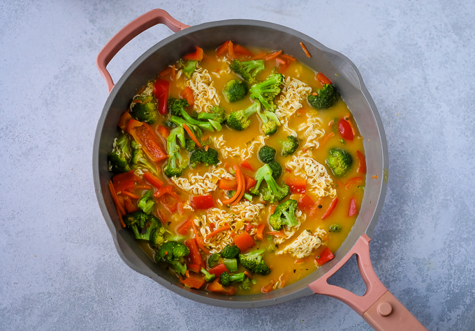 A pan of veggies with Yellow curry sauce