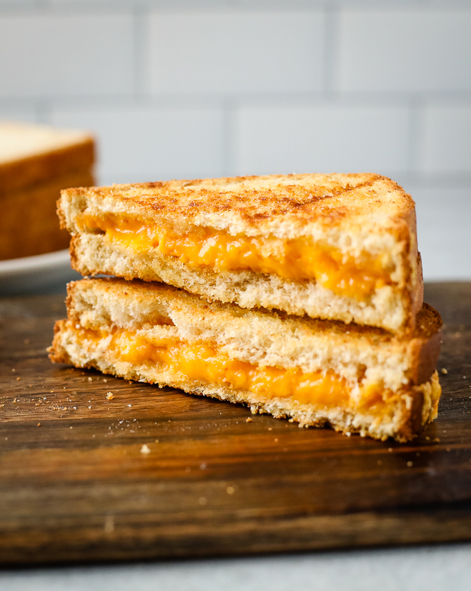 A close up of a grilled cheese on a table