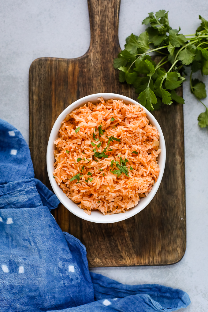 rice in a bowl on a cutting board