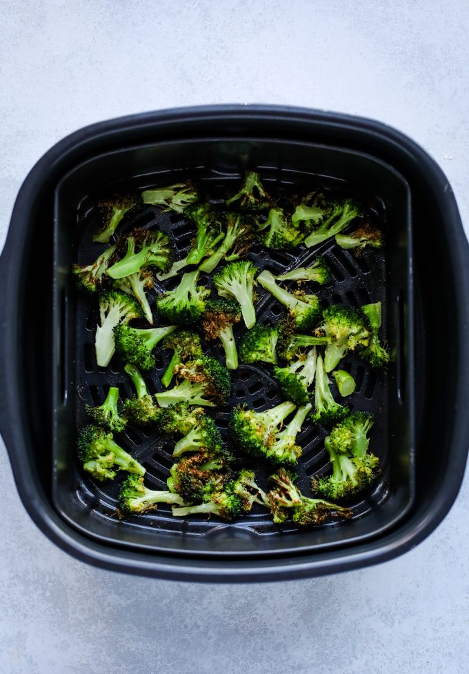 broccoli in an air fryer basket