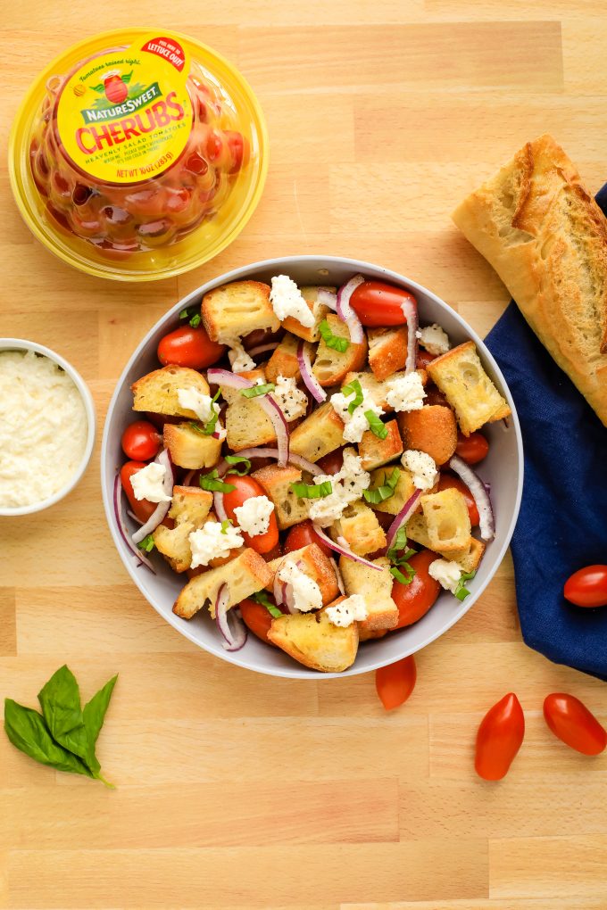 A plate of Panzanella on a wooden table