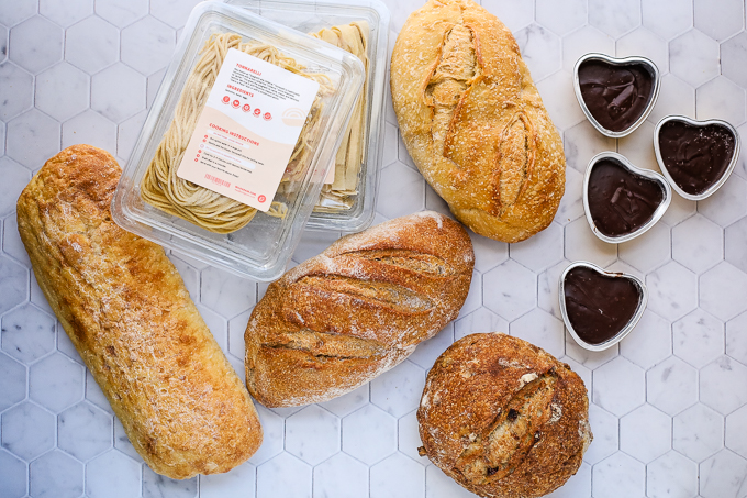 A box filled with different types wildgrain Bread