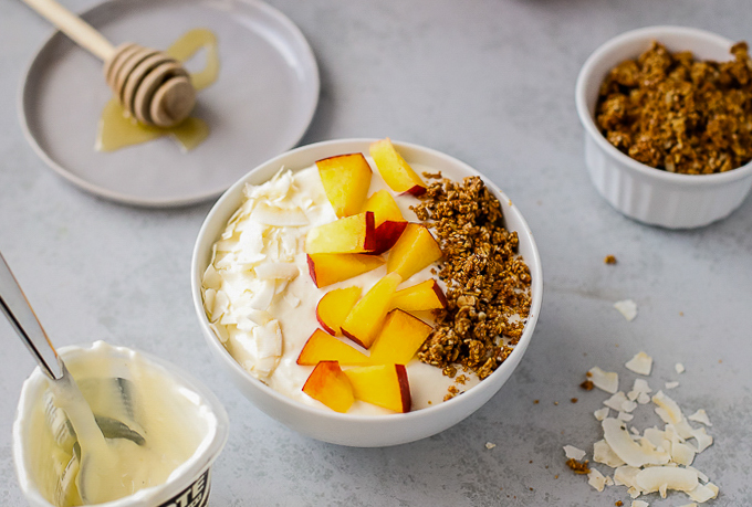 peach yogurt bowl with granola