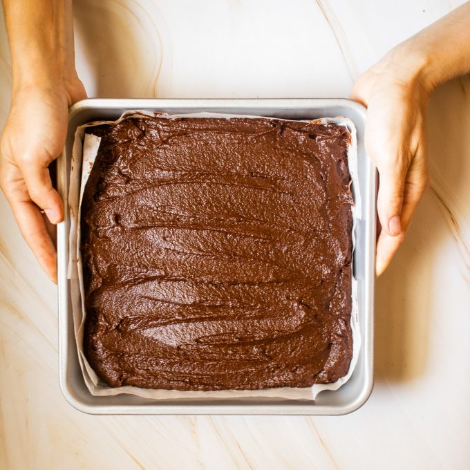 brownie batter spread in a pan