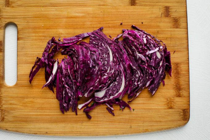 chopped purple cabbage on a cutting board
