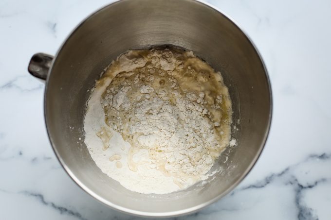 pizza dough in a mixing bowl