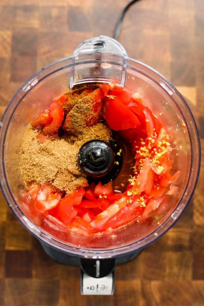 tomato jam ingredients in a food processor
