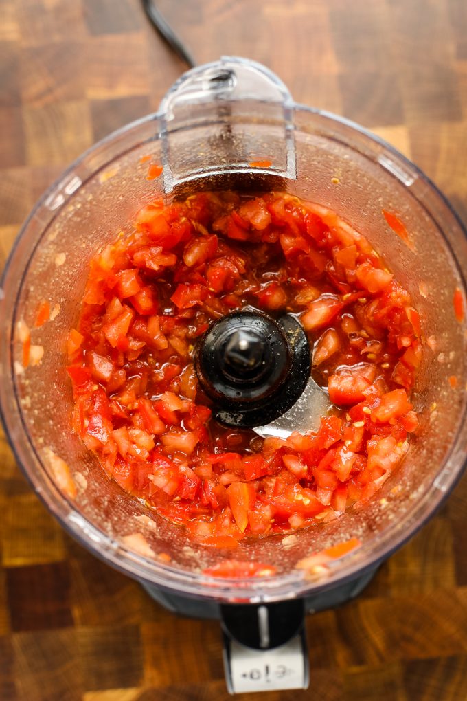 tomato jam ingredients in a food processor