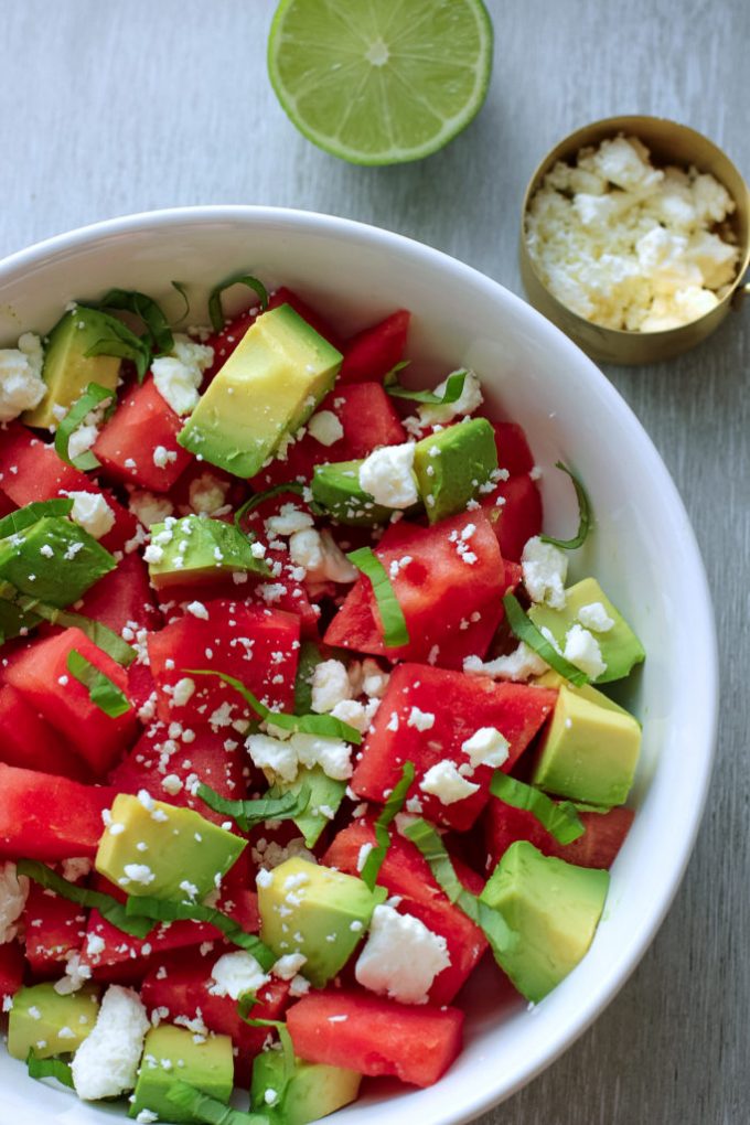 A bowl of fruit salad, with Watermelon and Avocado
