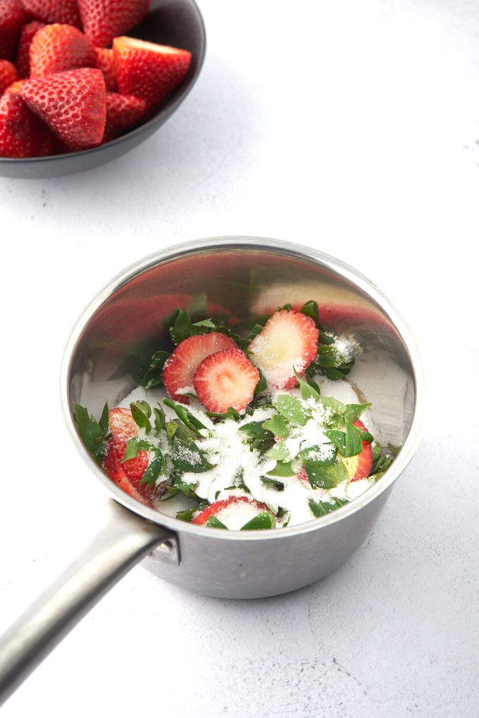 strawberries and sugar in a pot