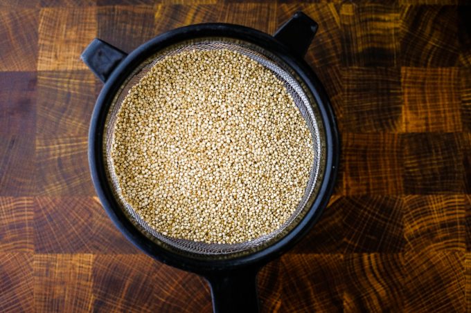 quinoa in a mesh strainer