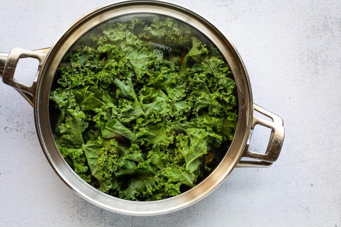 steamed kale in a skillet
