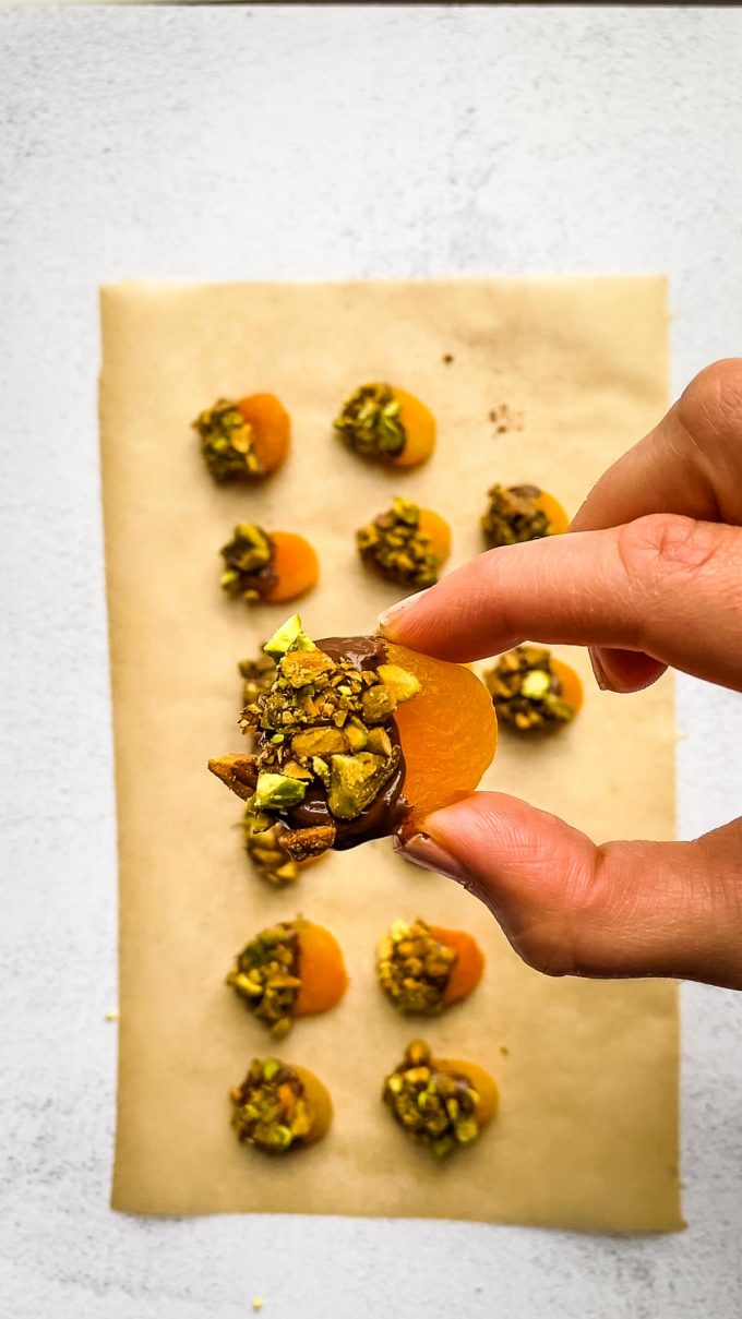 apricot dipped in chocolate and rolled in pistachios