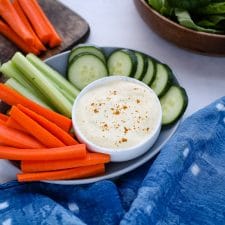 A bunch of vegetables on a plate with dip