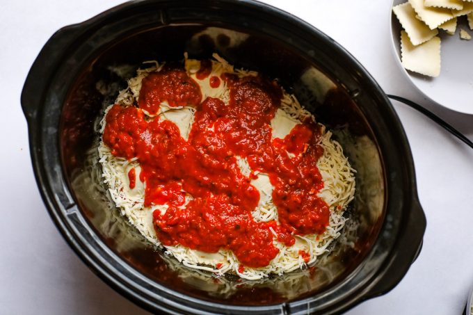 Ravioli lasagna ingredients in a slow cooker