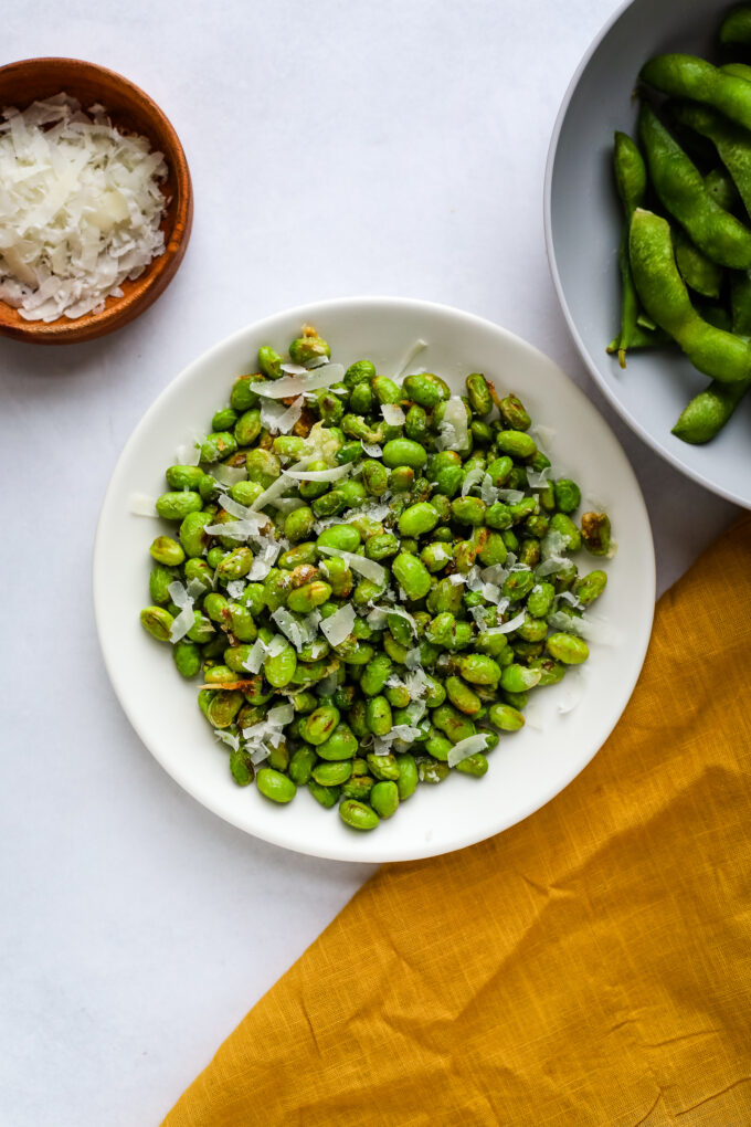 edamame in a bowl with parmesan