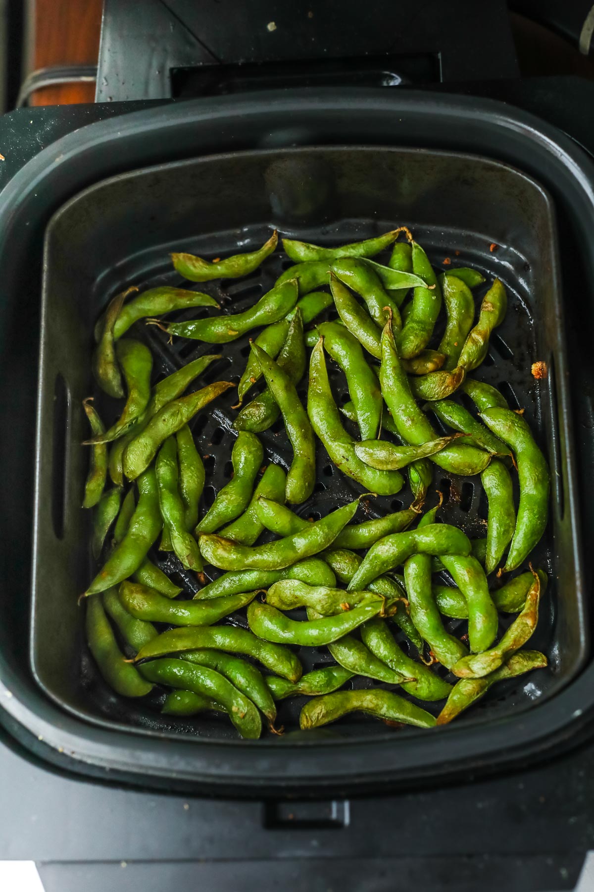 edamame in an air fryer basket