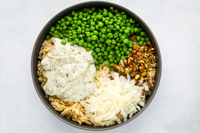 orzo pasta in a bowl with ricotta and pesto