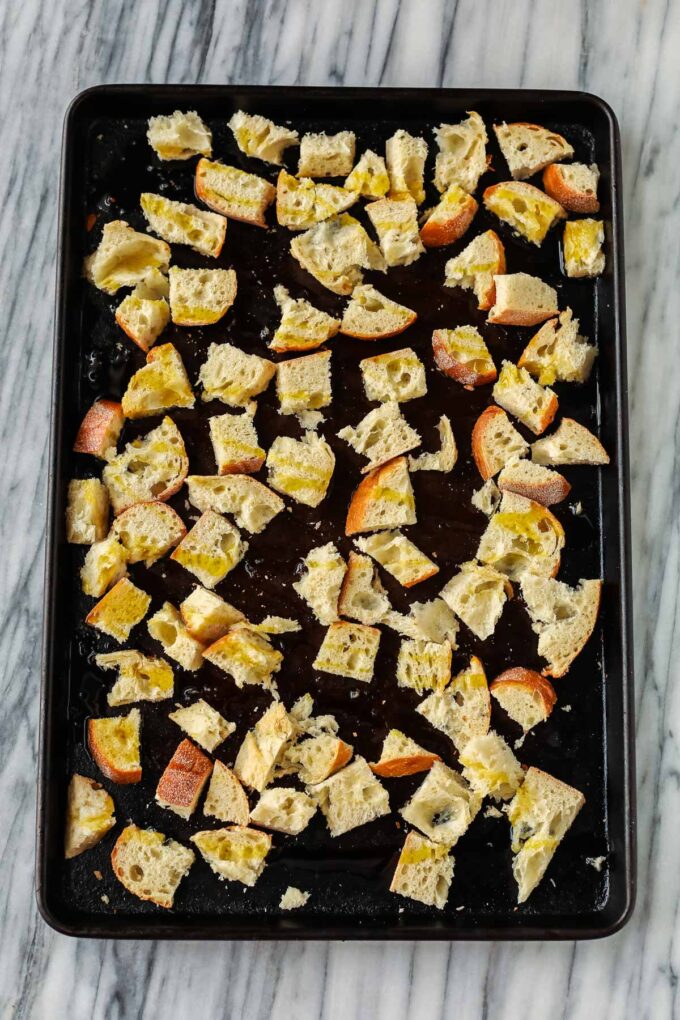 cubed bread on a pan